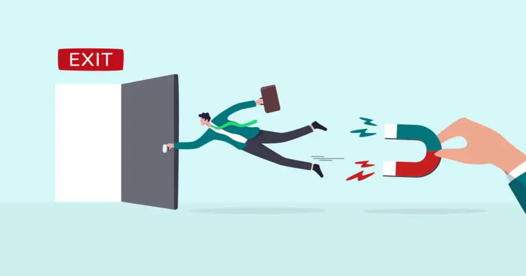Illustration of a worker being pulled off his feet and away from a door marked exit by a hand holding a large u-shamed magnet